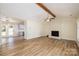 Living room with hardwood floors, fireplace and open concept to kitchen at 2400 Caswell Ct, Gastonia, NC 28054