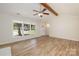 Bright living room with hardwood floors, vaulted ceiling, and large windows at 2400 Caswell Ct, Gastonia, NC 28054