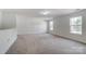 Spacious bedroom with neutral carpeting and two large windows at 3028 Semmes Ln, Indian Trail, NC 28079