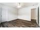 An empty bedroom featuring wood-look flooring, neutral paint, and a ceiling fan at 3028 Semmes Ln, Indian Trail, NC 28079