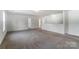 Large bonus room with neutral carpeting and multiple doors at 3028 Semmes Ln, Indian Trail, NC 28079