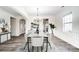 Elegant dining room with hardwood floors, chandelier, and white wainscoting at 3028 Semmes Ln, Indian Trail, NC 28079