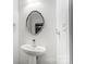 Clean powder room with pedestal sink and stylish mirror at 3028 Semmes Ln, Indian Trail, NC 28079