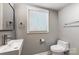 Modern bathroom featuring a floating vanity and toilet at 3335 Knob Hill Ct, Charlotte, NC 28210