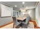 Elegant dining room featuring a wood table and statement art at 3335 Knob Hill Ct, Charlotte, NC 28210