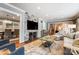 Open living room with view into dining area and fireplace at 3335 Knob Hill Ct, Charlotte, NC 28210