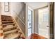 Stairway with runner leading to laundry and bath at 3335 Knob Hill Ct, Charlotte, NC 28210