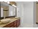 Double vanity bathroom with granite countertop and mosaic tile accents at 3957 Picasso Ct, Charlotte, NC 28205