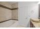 Bathroom features a jetted tub and beige tile at 3957 Picasso Ct, Charlotte, NC 28205