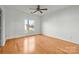 Spacious bedroom with hardwood floors and ceiling fan at 3957 Picasso Ct, Charlotte, NC 28205