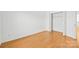 Bedroom with hardwood floors and double door closet at 3957 Picasso Ct, Charlotte, NC 28205