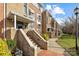 Townhouse building exterior with stone steps and landscaping at 3957 Picasso Ct, Charlotte, NC 28205