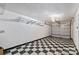 Checkerboard garage floor with overhead storage racks at 3957 Picasso Ct, Charlotte, NC 28205