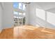 Sunlit living room with hardwood floors and sliding doors at 3957 Picasso Ct, Charlotte, NC 28205