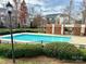 Community pool with brick building and surrounding fence at 3957 Picasso Ct, Charlotte, NC 28205