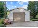 Single-car detached garage with light brown garage door at 401 Stokes Ave, Clover, SC 29710