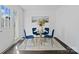 Charming dining room with a glass-top table and four blue velvet chairs at 401 Stokes Ave, Clover, SC 29710