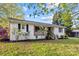 Cute white ranch home with covered porch and landscaping at 401 Stokes Ave, Clover, SC 29710