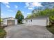 Home's back exterior showcasing a detached garage and patio area at 401 Stokes Ave, Clover, SC 29710