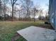 Large backyard with patio and trees at 4830 Carnbrook Pl, Charlotte, NC 28212