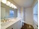 Modern bathroom with double vanity, shower, and white tile at 4830 Carnbrook Pl, Charlotte, NC 28212