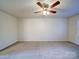 Simple carpeted bedroom with ceiling fan at 4830 Carnbrook Pl, Charlotte, NC 28212