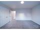 Bright bedroom with double door closet and access to hallway at 4830 Carnbrook Pl, Charlotte, NC 28212