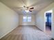 Spacious bedroom with carpeted floor and ceiling fan at 4830 Carnbrook Pl, Charlotte, NC 28212