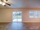 Open dining area with sliding glass doors and backyard access at 4830 Carnbrook Pl, Charlotte, NC 28212