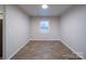 Bright dining room with wood-look floors and neutral walls at 4830 Carnbrook Pl, Charlotte, NC 28212