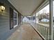 Covered front porch with white railing and gray siding at 4830 Carnbrook Pl, Charlotte, NC 28212