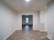 View of a hallway with wood-look floors at 4830 Carnbrook Pl, Charlotte, NC 28212