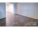 Spacious living room with hardwood floors and an open floor plan at 4830 Carnbrook Pl, Charlotte, NC 28212