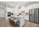 Modern kitchen with island, stainless steel appliances, and white cabinetry at 8616 Miles Gap Rd, Indian Land, SC 29707