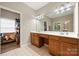 Double vanity bathroom with large mirror and storage at 9243 Island Overlook Ct, Cornelius, NC 28031