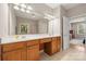 Double vanity bathroom with large mirror and ample counter space at 9243 Island Overlook Ct, Cornelius, NC 28031