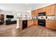 Modern kitchen with stainless steel appliances and wood cabinets at 9243 Island Overlook Ct, Cornelius, NC 28031