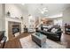 Living room with fireplace, hardwood floors, and comfortable seating at 9243 Island Overlook Ct, Cornelius, NC 28031