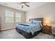 Spacious main bedroom with large bed, nightstands, and ample natural light at 9243 Island Overlook Ct, Cornelius, NC 28031