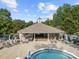 Community pool and hot tub with lounge chairs and covered seating area at 9243 Island Overlook Ct, Cornelius, NC 28031