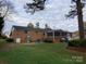 Brick ranch house with a screened porch and yard at 9608 Sunway Dr # 4, Mint Hill, NC 28227