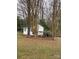 White storage shed with a fenced dog run at 9608 Sunway Dr, Mint Hill, NC 28227