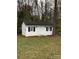 White storage shed with black shutters in backyard at 9608 Sunway Dr, Mint Hill, NC 28227