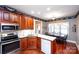 Kitchen with ample counter space, wood cabinets, and a breakfast nook at 1005 Woodhurst Dr, Monroe, NC 28110