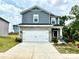 Charming two-story home featuring stone accents, a two-car garage, and a well-maintained front yard at 102 Alden Ct, Shelby, NC 28152