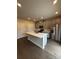 Modern kitchen features a large island, stainless steel appliances, and gray cabinets at 102 Alden Ct, Shelby, NC 28152