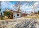 The exterior showcases a quaint property, featuring a driveway and mature trees at 1254 Huckleberry Dr, Lincolnton, NC 28092