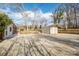 This backyard offers a storage building and ample parking space at 1254 Huckleberry Dr, Lincolnton, NC 28092
