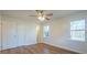 Bright bedroom with hardwood floors, large windows, a ceiling fan, and a closet at 1254 Huckleberry Dr, Lincolnton, NC 28092