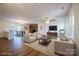 Staged living room featuring a brick fireplace, a spacious sitting area, and hardwood floors at 1254 Huckleberry Dr, Lincolnton, NC 28092